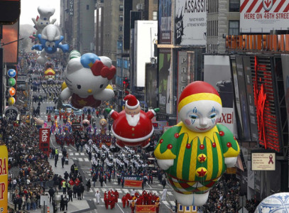 Balloons are paraded down 7th avenue during the 83rd Macy's Thanksgiving day parade in New York